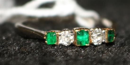 A platinum, emerald and diamond five stone ring